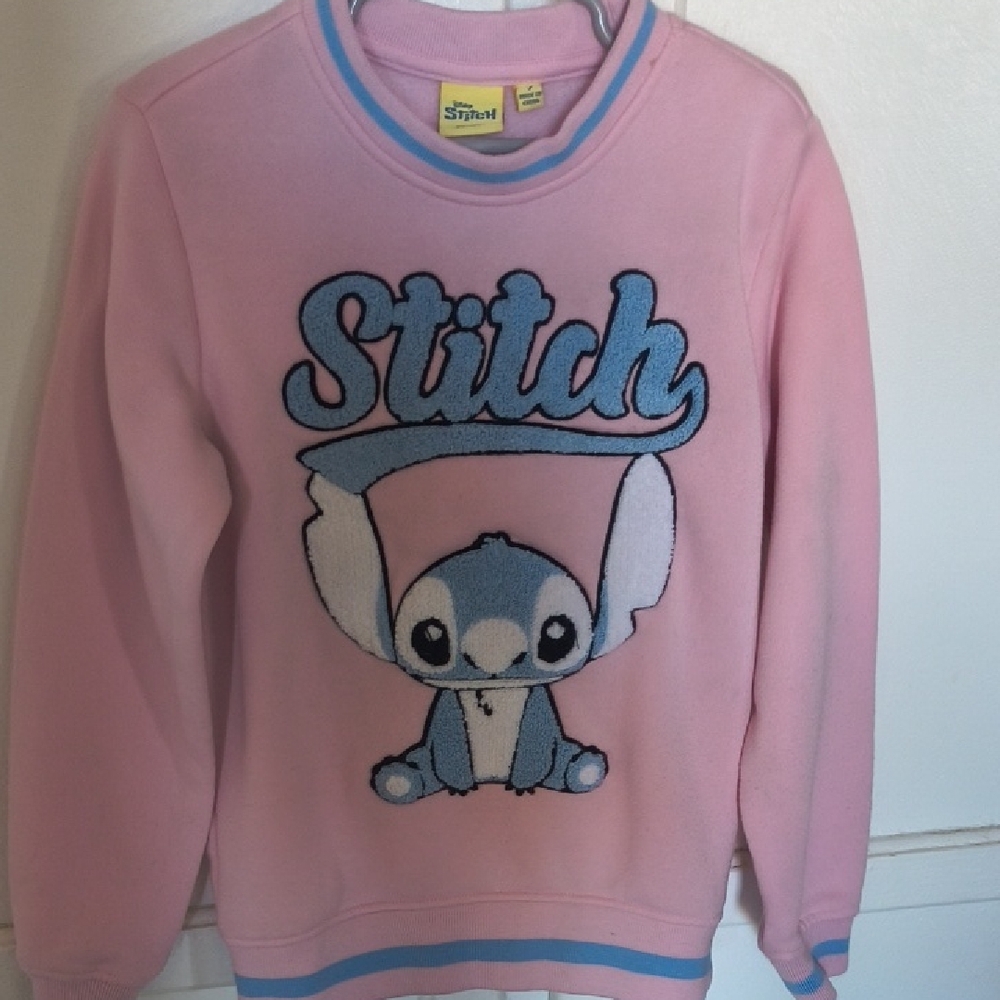 Disney Pink Top with Yellow Stitch Label and Blue Logo